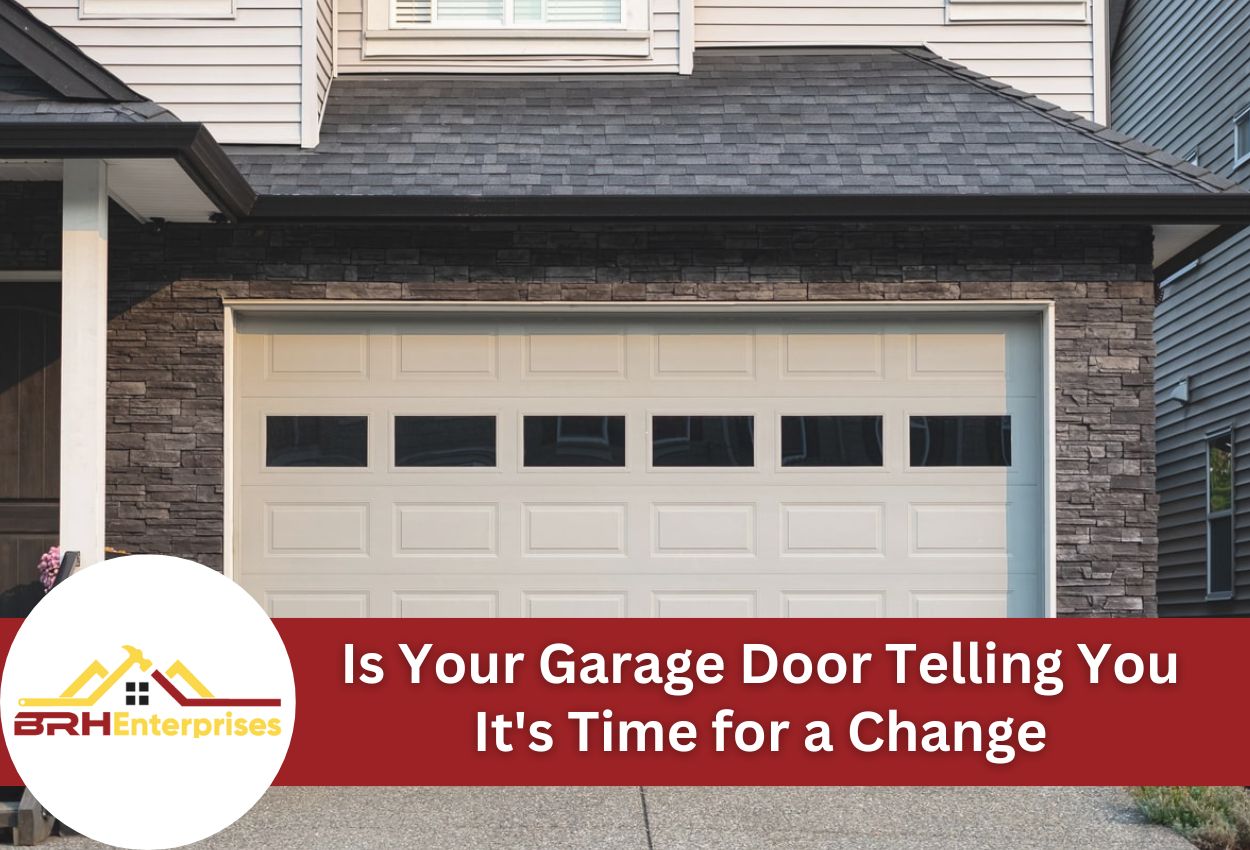 Modern residential garage door with windows on stone and siding home exterior