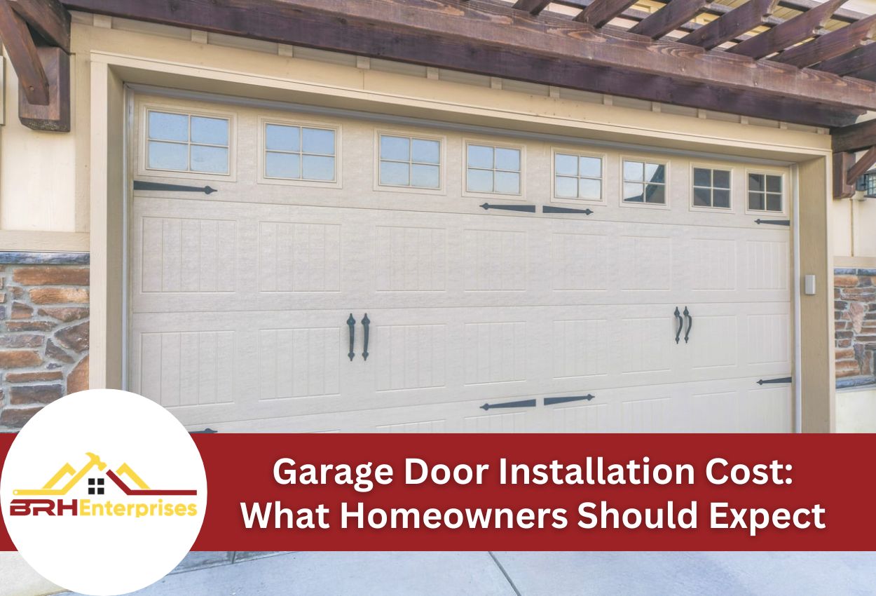 Garage door with stone siding and wooden pergola above.